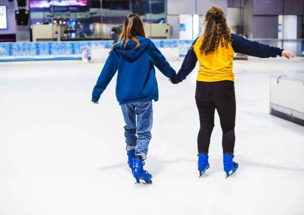 two girls ice skating